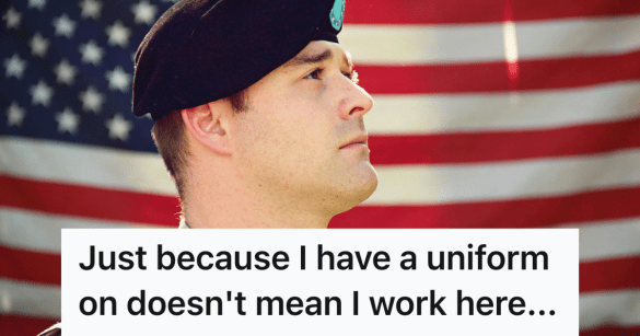 soldier standing in front of an american flag