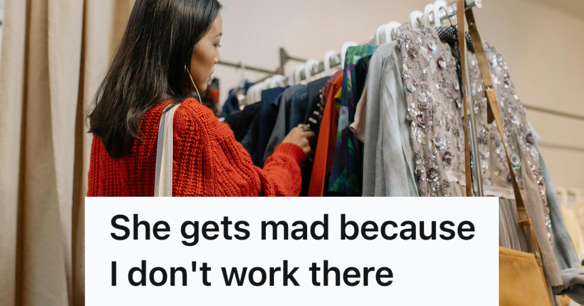woman looking through rack of clothes