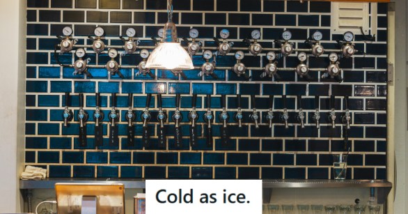 The back wall of a bar filled with beer spouts