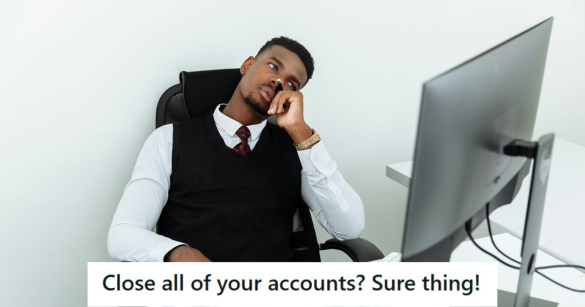 Man sitting tiredly next to a computer at work