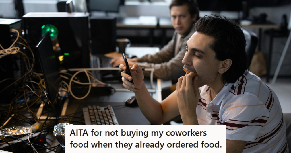 boy eating in office in front of coworker
