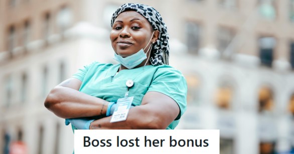 Nurse smiling at the camera very proud of her career