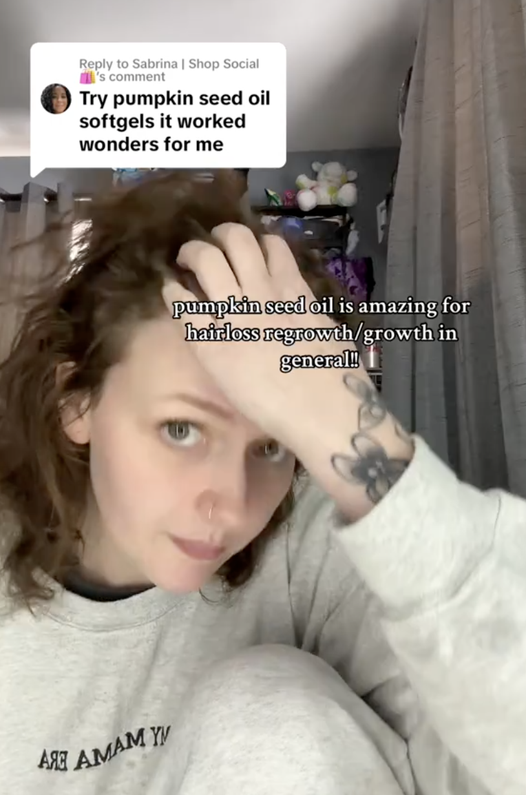 woman running her hands through her hair