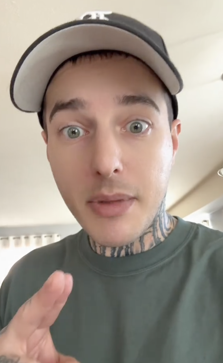 man with neck tattoos