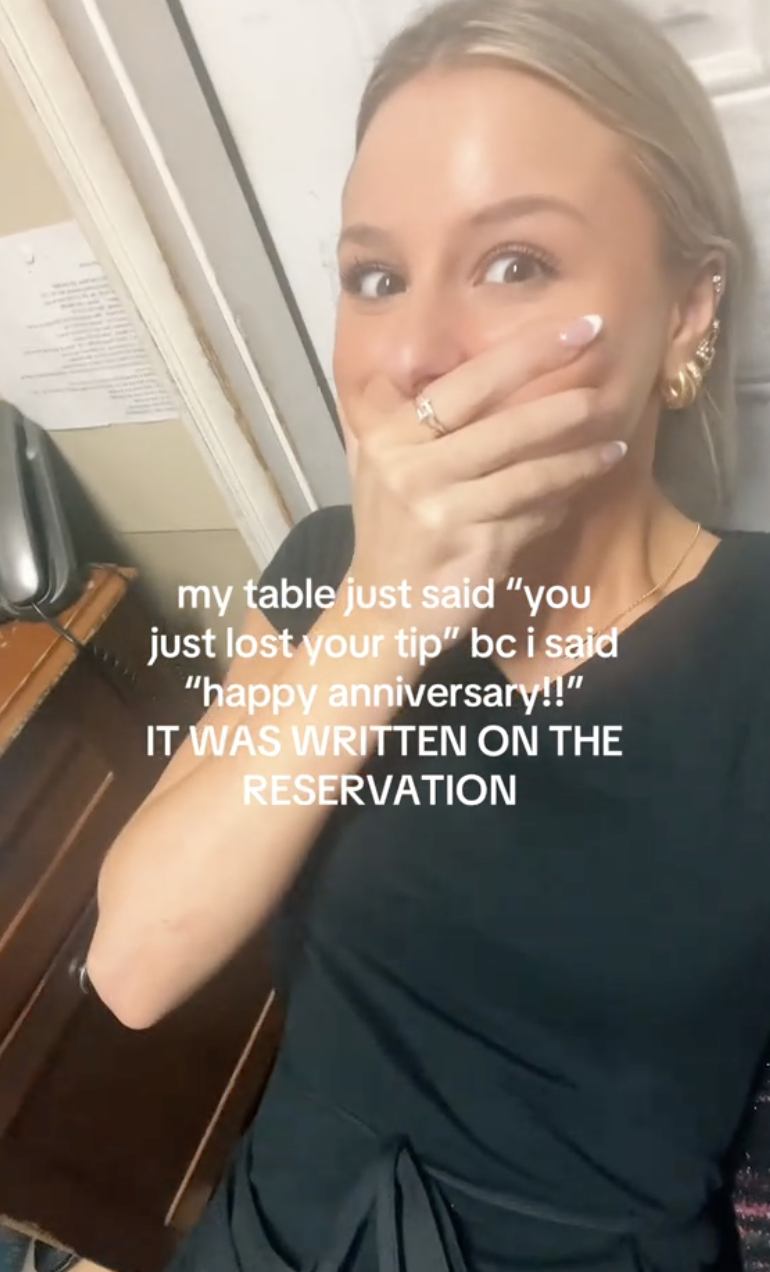 woman covering her mouth