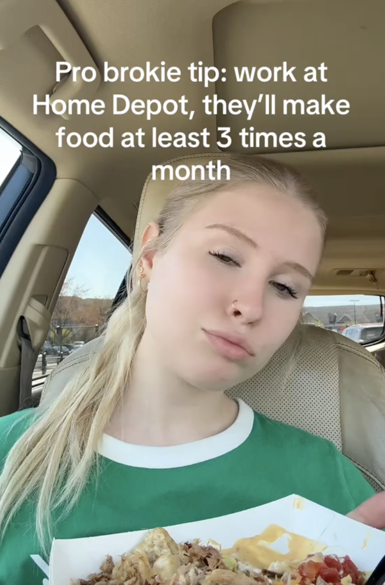 woman in her car holding nachos