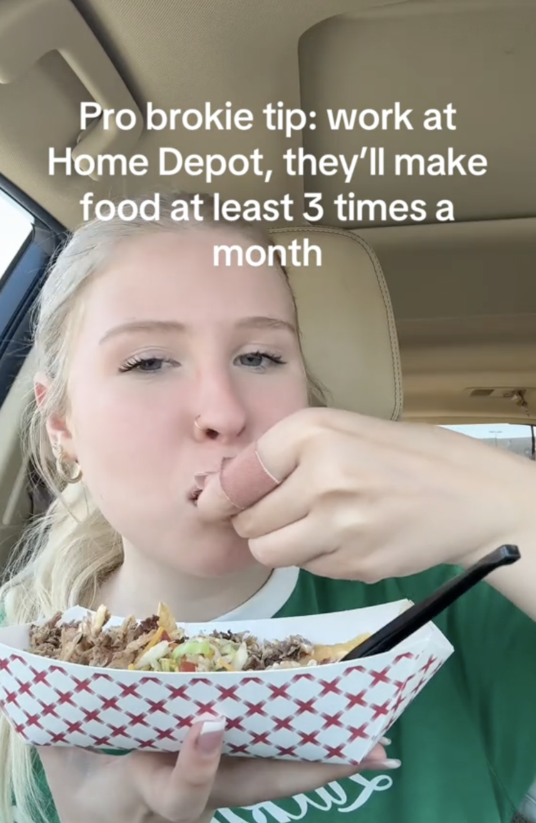 woman eating nachos in a car