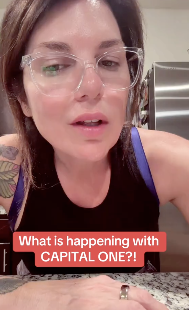 woman with glasses and a tank top