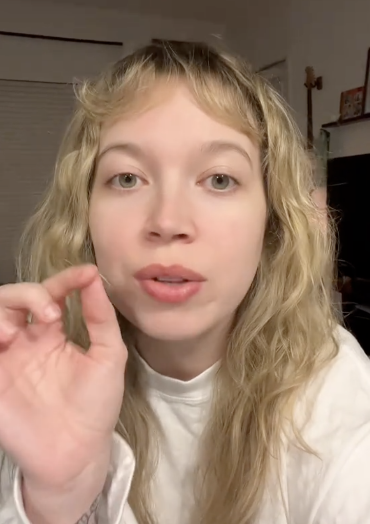 woman making a tiktok video