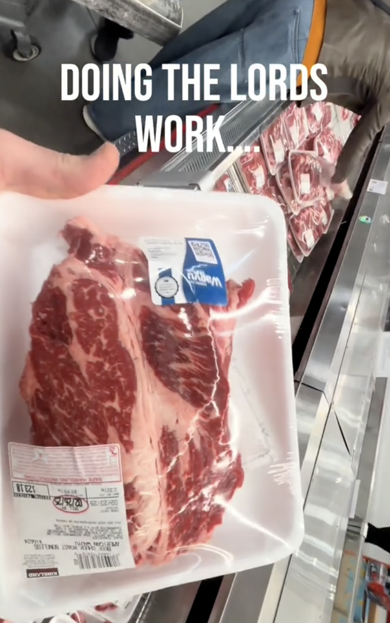 man showing off steak