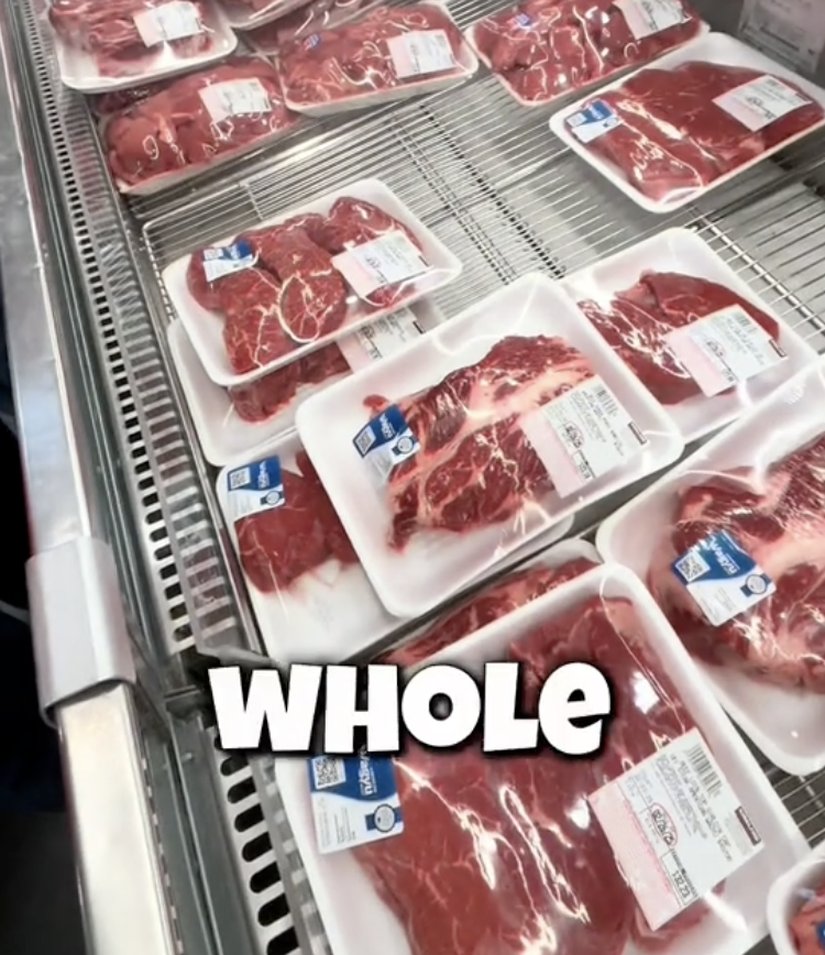man talking about steak at grocery store