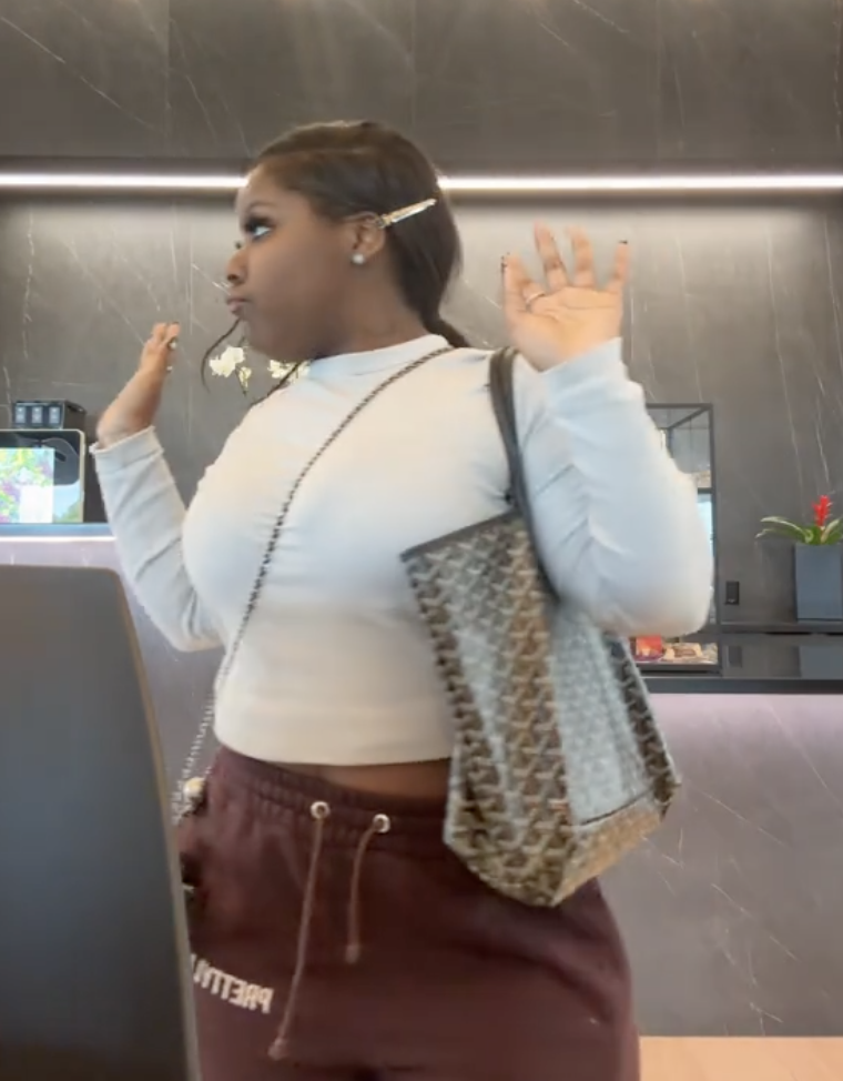 woman holding up her arms