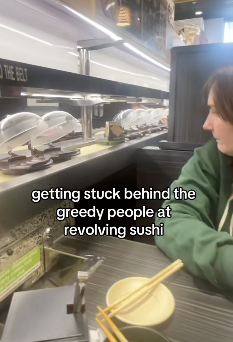 woman at a sushi restaurant