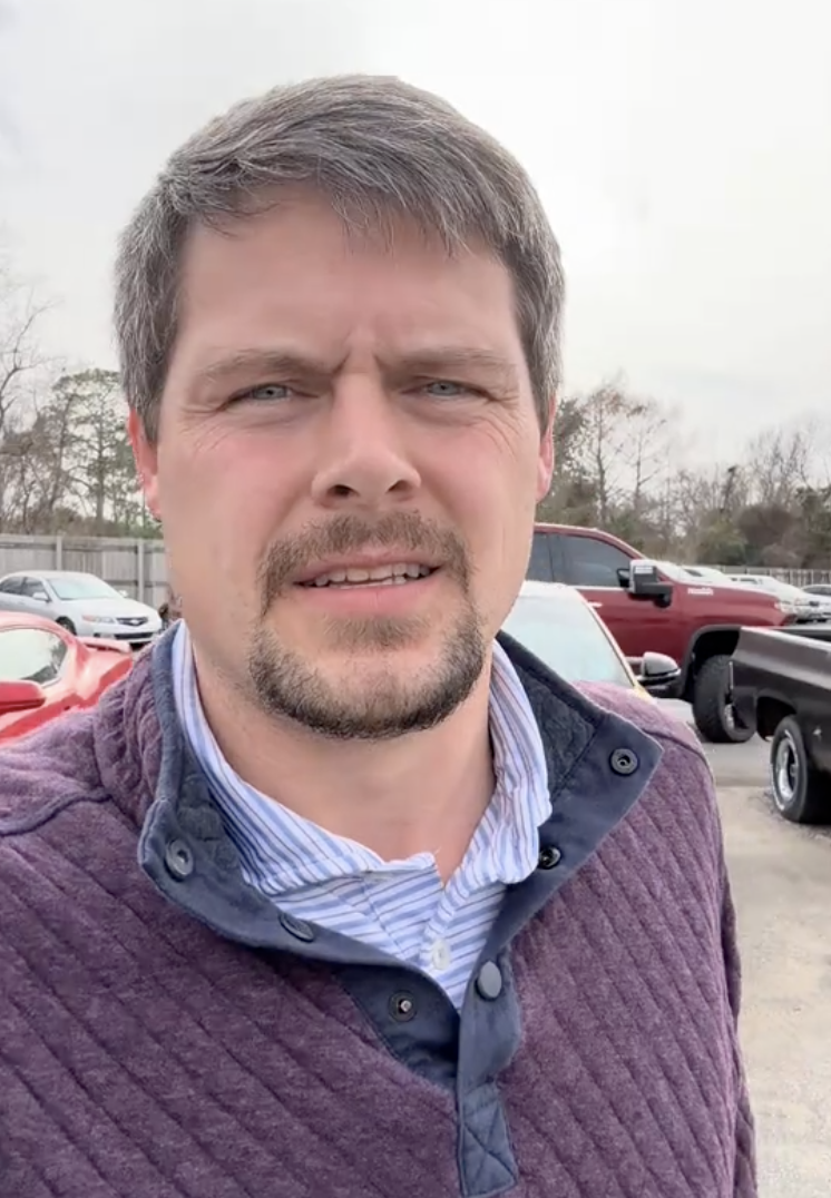 man talking about cars