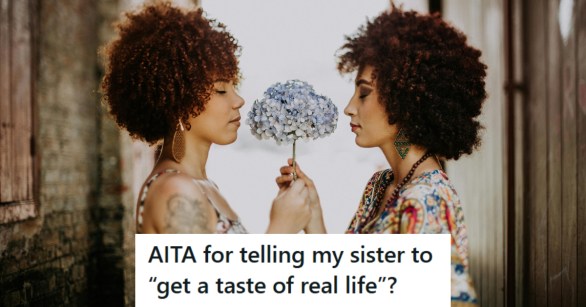 Two sisters standing face to face holding a flower