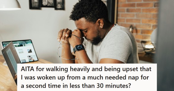 Man sitting at his computer wiping his tired eyes