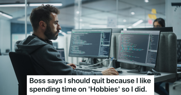 employee sitting at computer coding