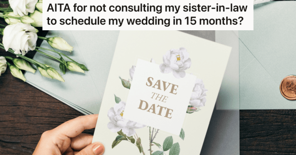 woman's hand holding a "save the date" card