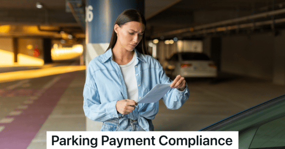 woman looking at a parking ticket