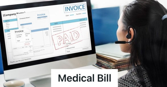 Account officer looking at a paid invoice on her computer screen