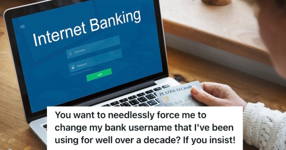 A person logging into their online banking account on their laptop while holding their credit card