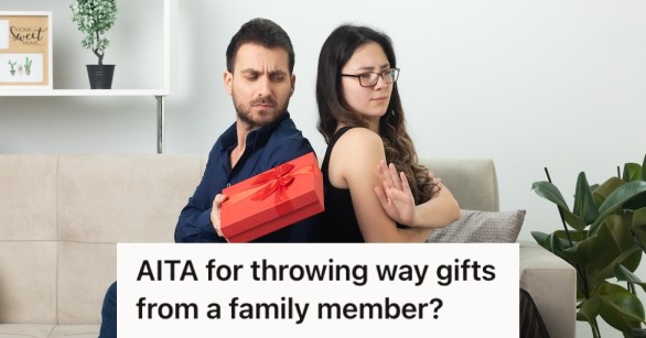 Man handing a gift to his wife but she isn't pleased with it