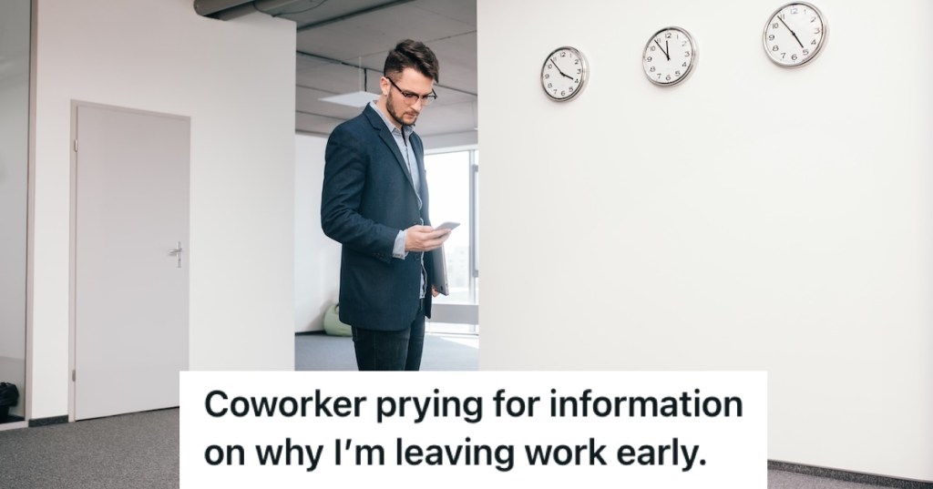 Well-dressed man in suit walking in the office while looking at his phone