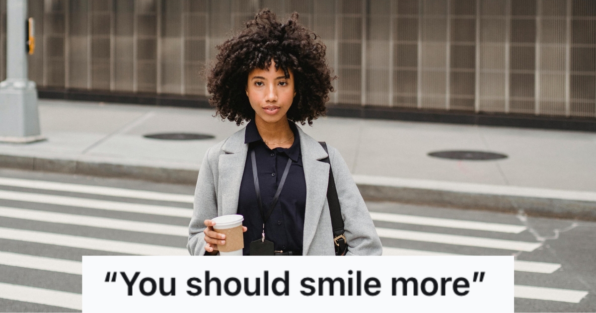 Woman seriously walking on the street while holding a cup of coffee