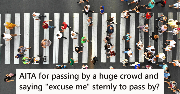 crowd of people using a crosswalk