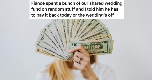 person fanning/holding dollar bills