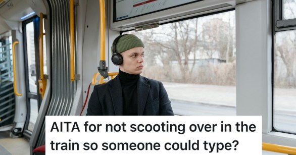 man working on computer on the train