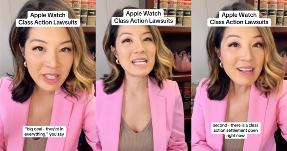 woman in a pink suit talking to a camera