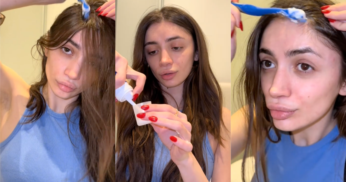 woman putting product in her hair