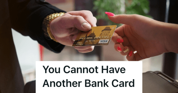 woman handing a person her debit card