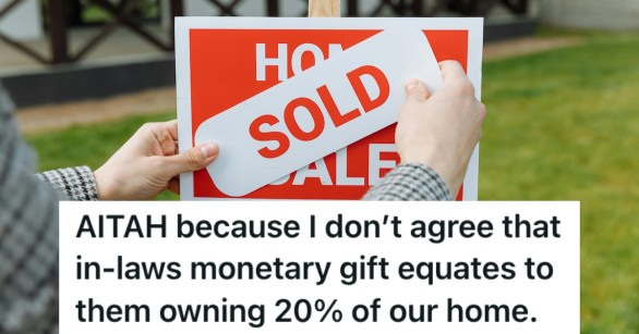 A sold sign being placed over a house for sale sign