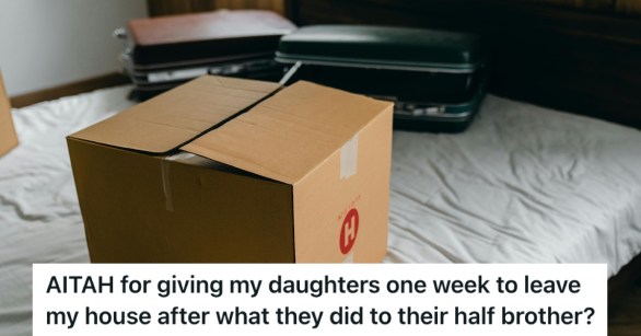 A cardboard box and two suitcases on a bed