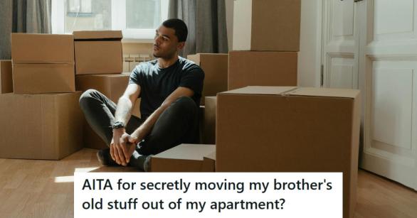 Man sitting on his living room floor amongst boxes