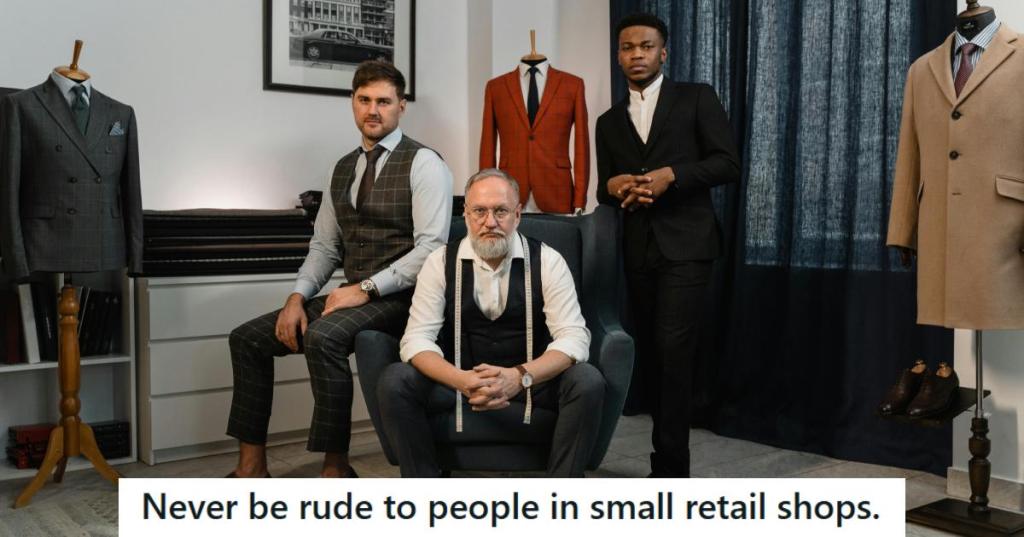 Three well-dressed men posing in a men's suit shop