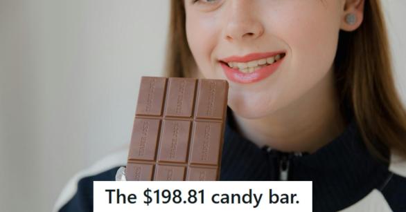 Woman smiling and happy that she's about to eat a candy bar