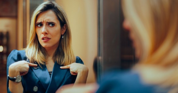 Woman pointing at herself