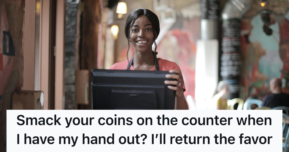 Woman smiling behind cash register