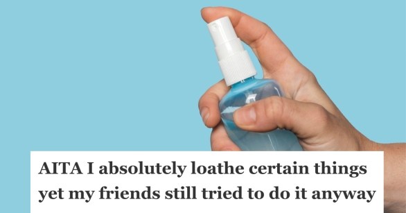 A person's hand holding a hand sanitizer spray in a bottle.