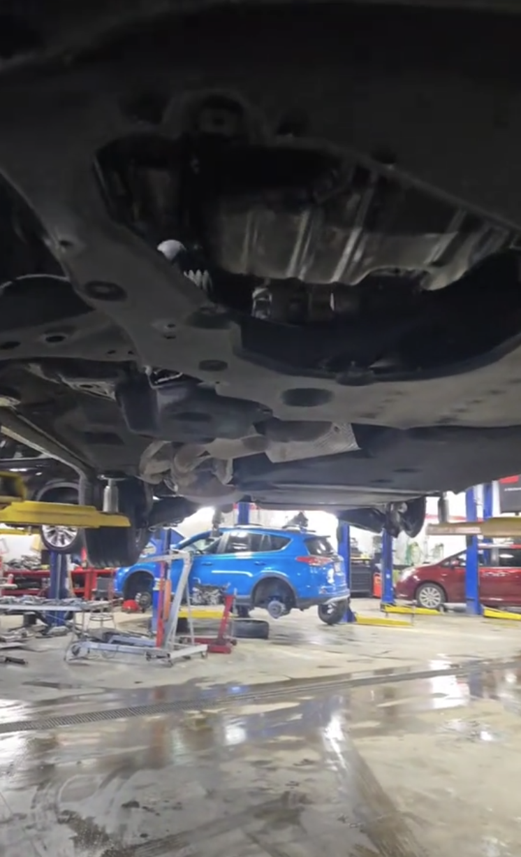 the underside of a car on a lift