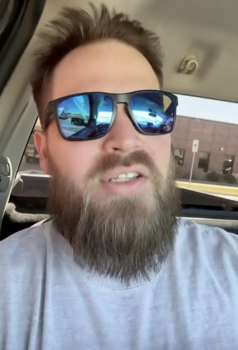 a man talking in his car