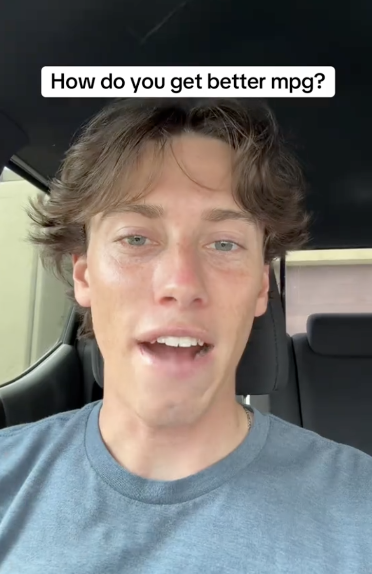 man talking in his car