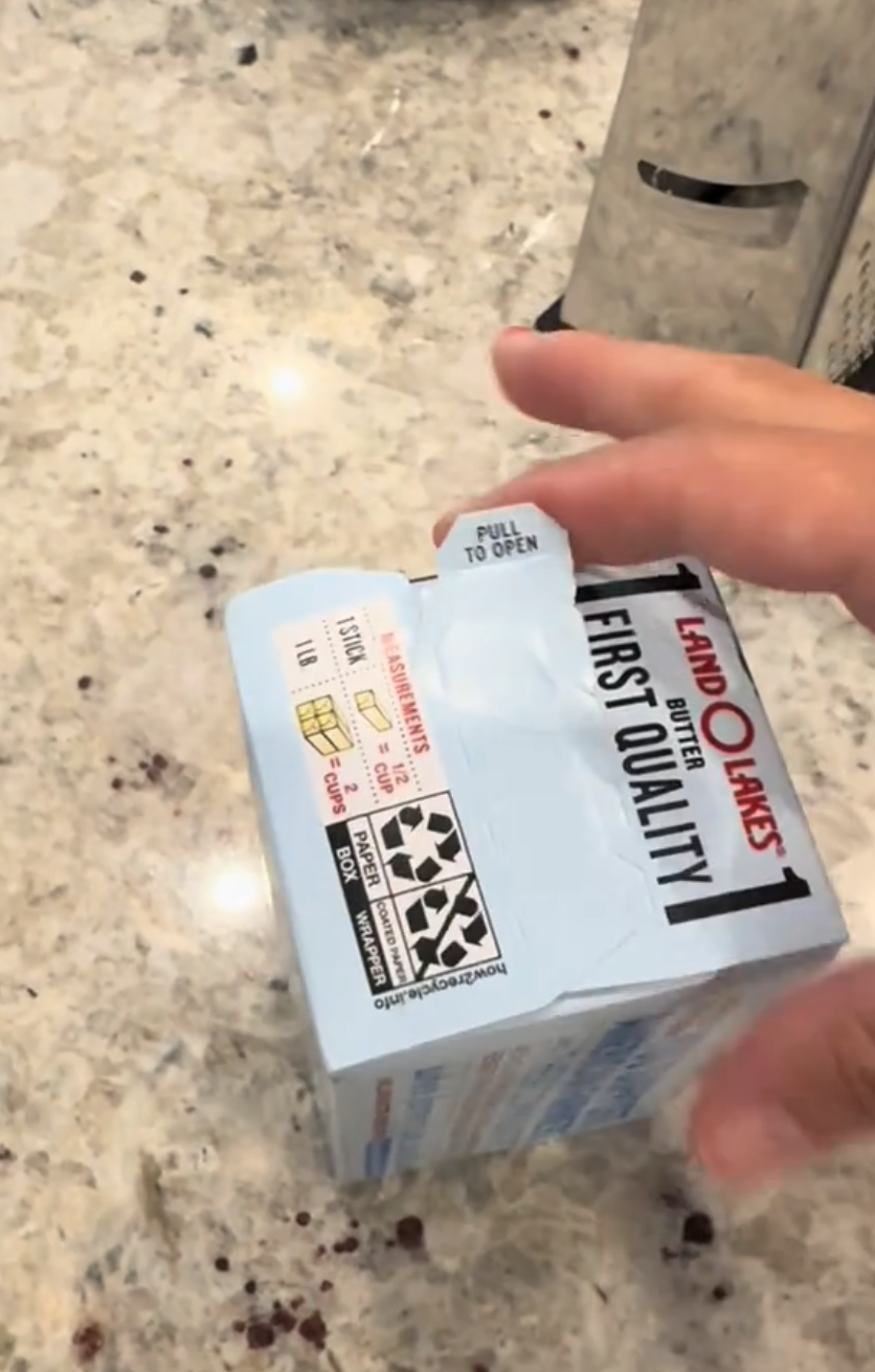 Opening a box of butter