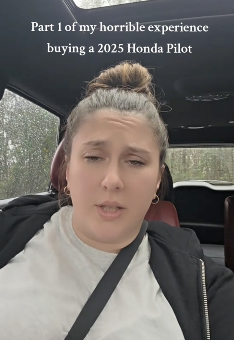 woman sitting in her car