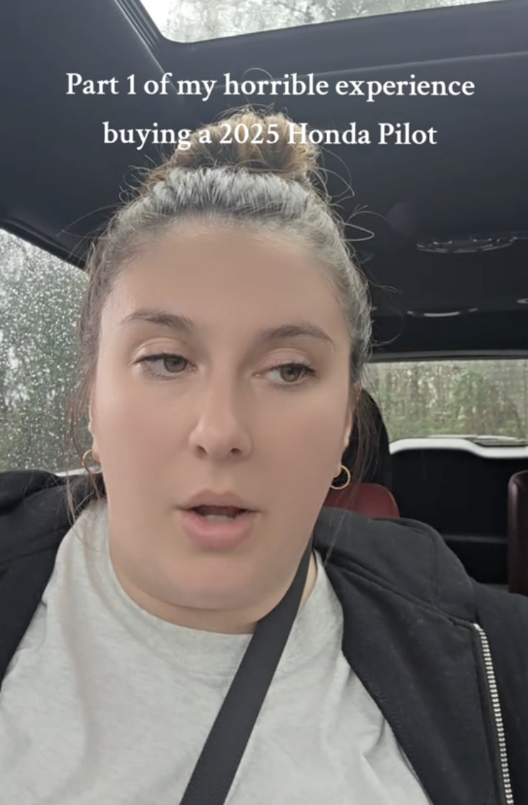 woman talking to viewers in her car