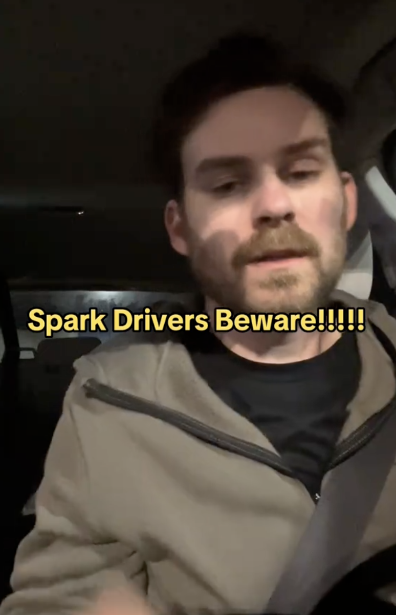 man talking in his car