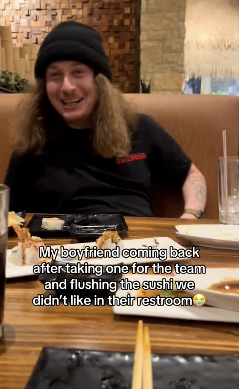 man sitting in a booth